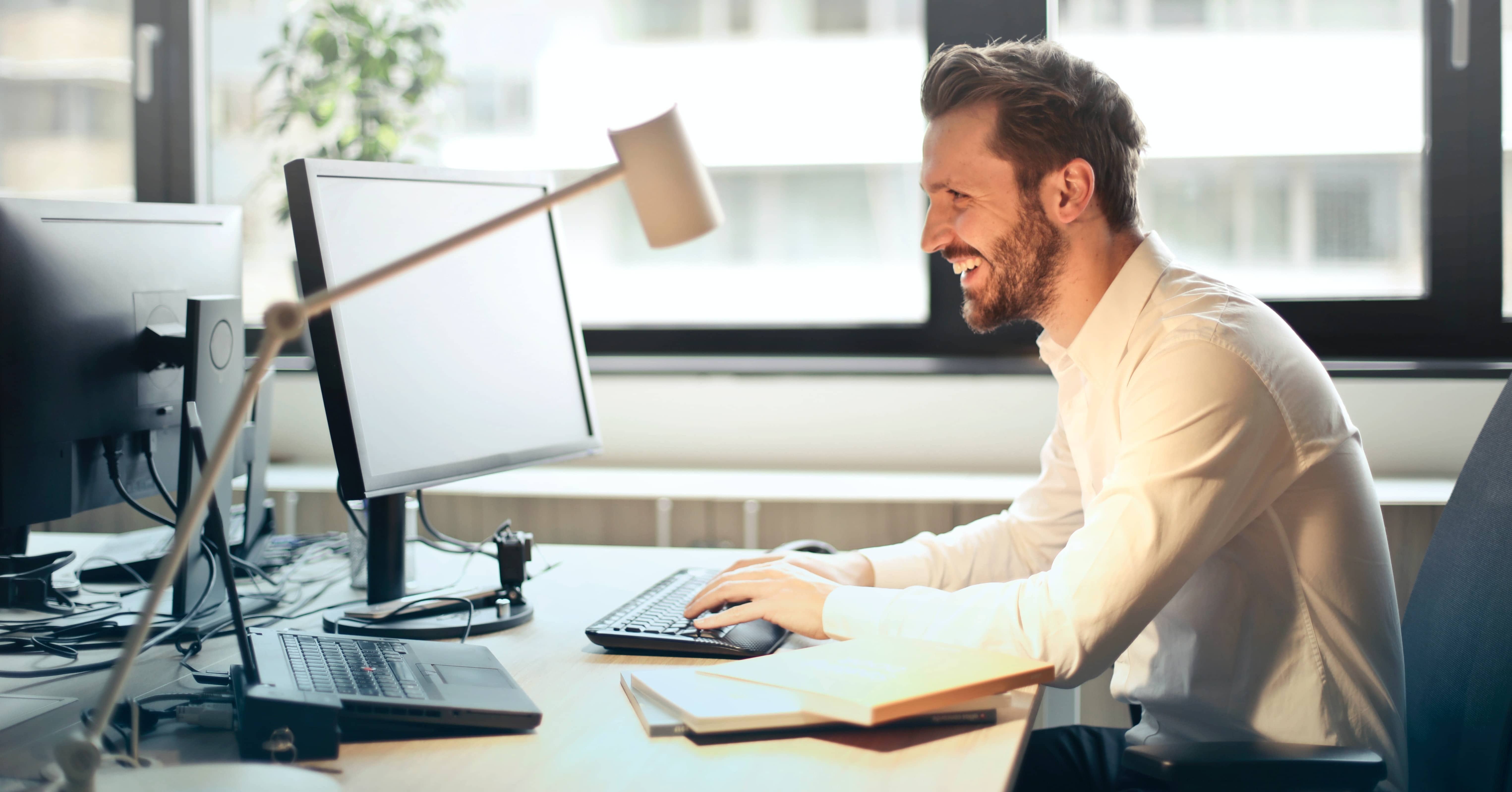 man sat at computer