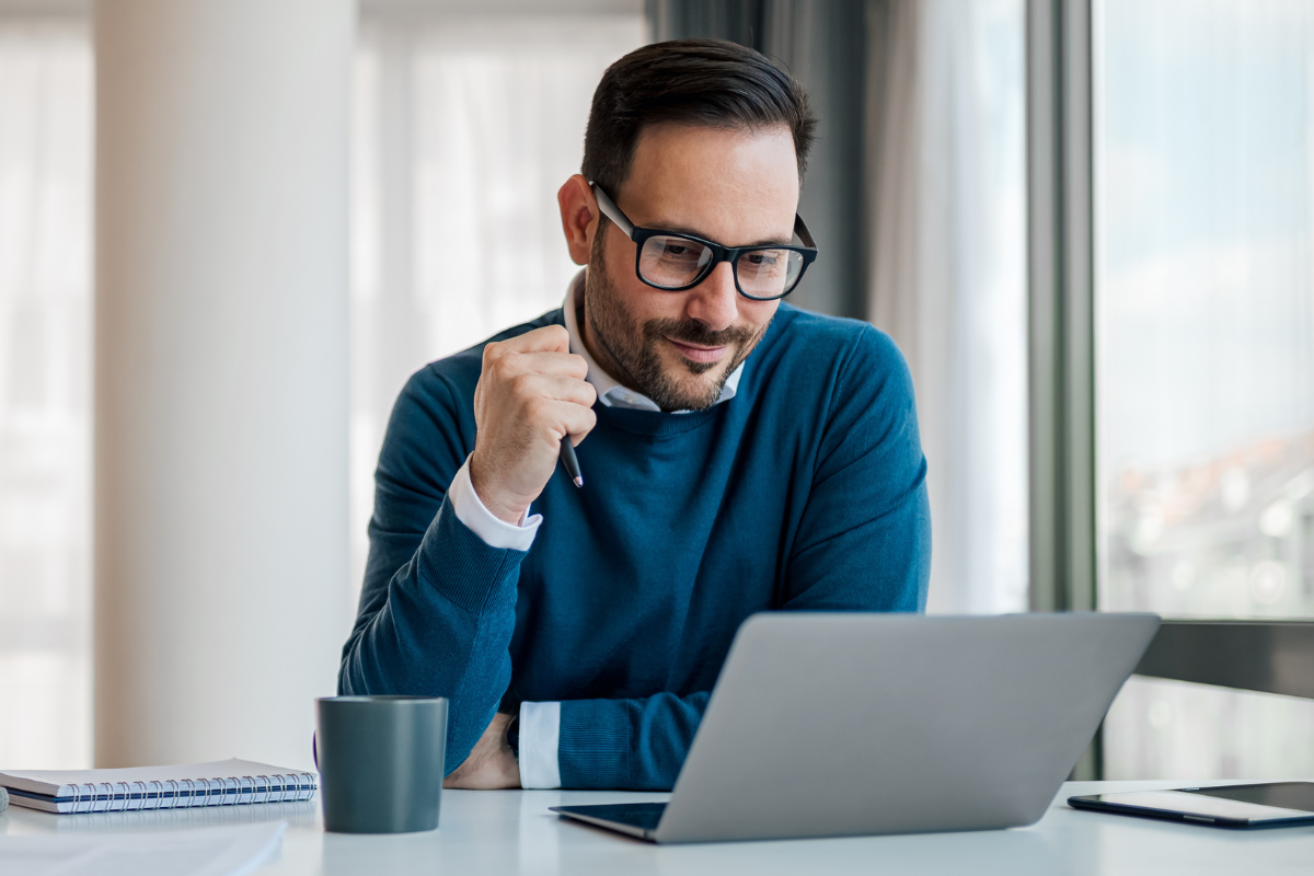 businessman works at laptop